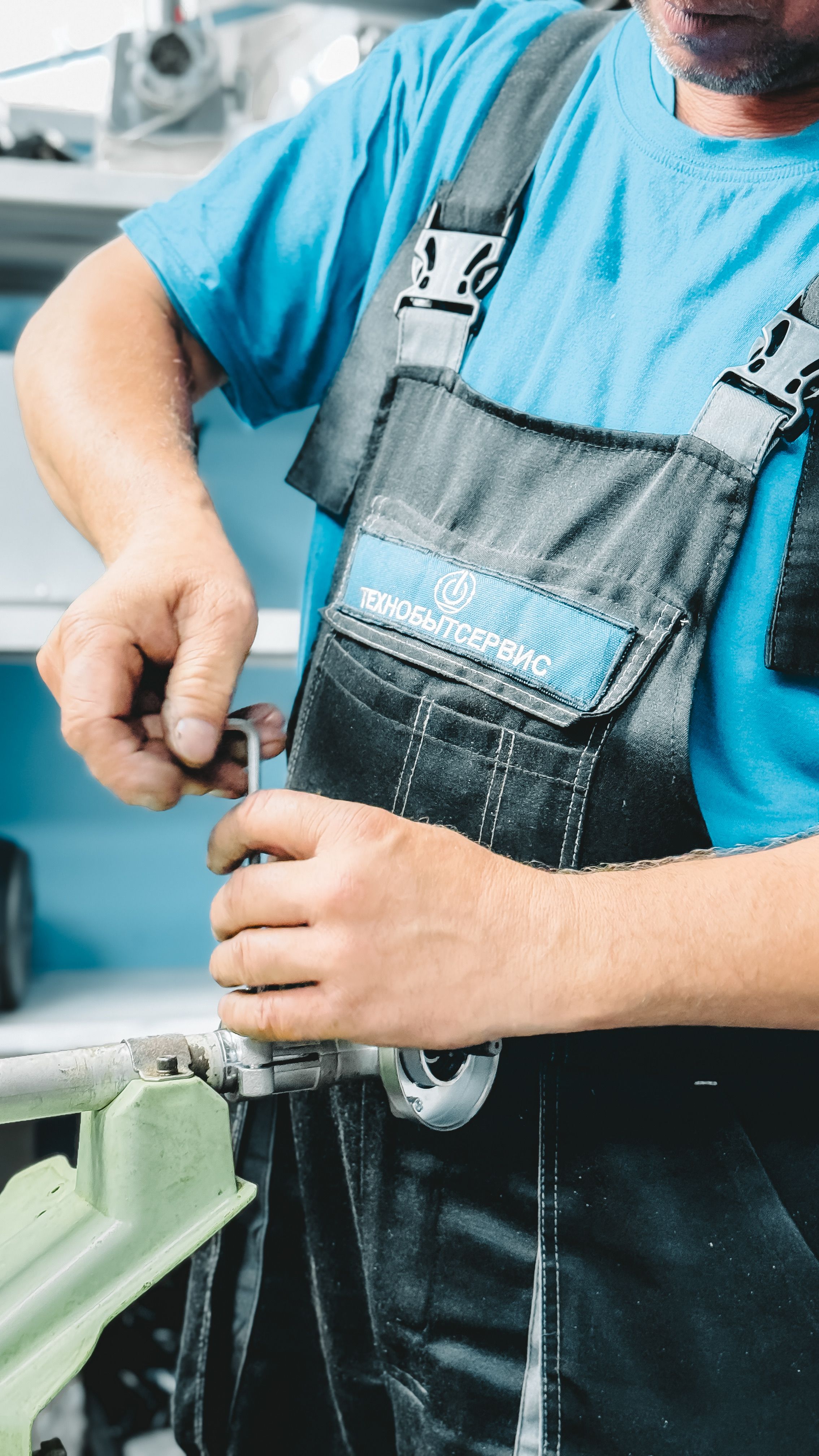 Professional plumber repairing a pipe indoors