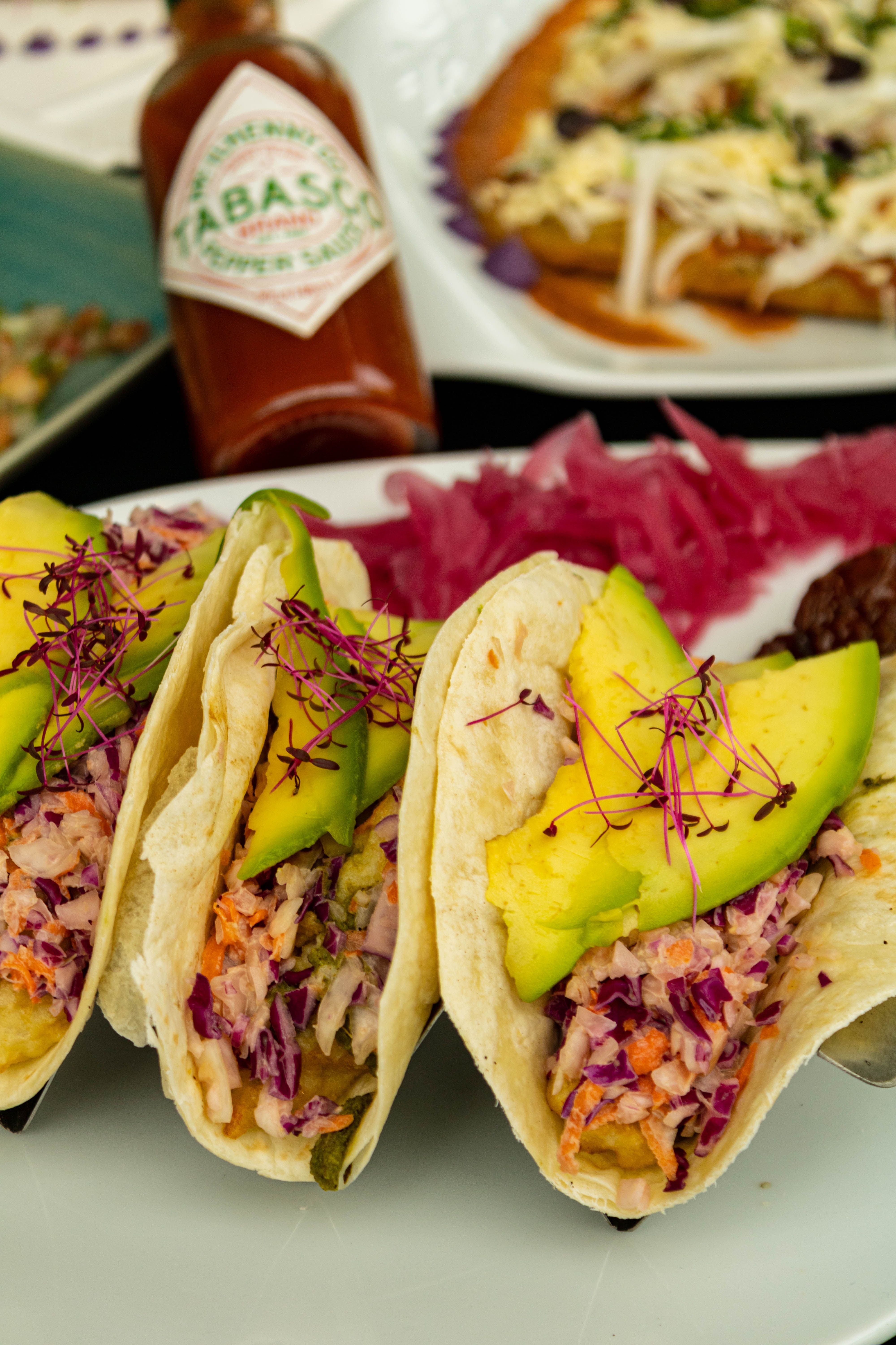 Generic plate of restaurant tacos with fresh toppings